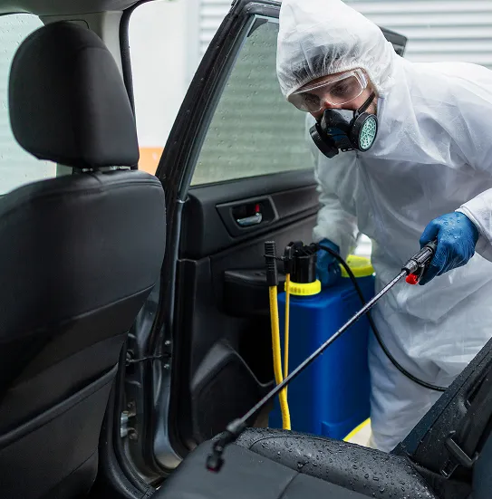 medium-shot-man-disinfecting-car 1